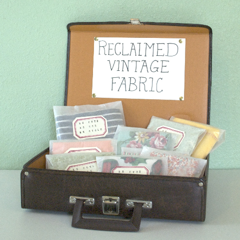 vintage fabric displayed in a suitcase vintage fabric displayed in a suitcase